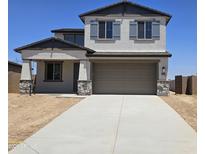 Charming two-story home with stone accents and a spacious two-car garage at 22400 W Monona Ln, Surprise, AZ 85387