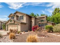 Inviting two-story home with a well-manicured, low maintenance front yard at 4062 W Cielo Grande --, Glendale, AZ 85310