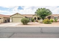 Single story home with green paint, tiled roof, green garage door, and desert landscaping at 4110 E Brighton Way, San Tan Valley, AZ 85140