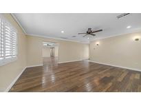 Spacious living room with hardwood floors, recessed lighting, and neutral paint at 1001 W Northern Ave, Phoenix, AZ 85021