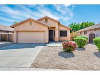 Charming single story home with landscaped yard and two car garage at 16515 N 71St Dr, Peoria, AZ 85382