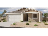 Charming single-story home features a tan exterior, a two-car garage, and desert landscaping at 5507 W Piedmont Rd, Laveen, AZ 85339