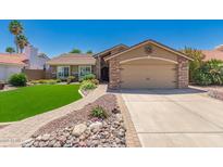 Beautiful single-story home with a well-maintained front yard and attached two-car garage at 7185 W Kimberly Way, Glendale, AZ 85308