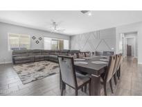 Comfortable living area with ample seating, stylish decor, and plenty of natural light at 22977 E Desert Spoon Dr, Queen Creek, AZ 85142