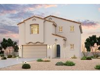 Charming two-story home with a stucco exterior, tile roof, arched entryway, and well-maintained landscaping at 2663 E Dutchmans Trl, Apache Junction, AZ 85119