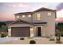 Inviting two-story home with a warm color scheme, two-car garage, and beautiful desert landscaping at 2720 E Dutchmans Trl, Apache Junction, AZ 85119