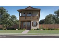 Charming two-story home with a balcony, brick accents, and desert landscaping at 3330 S Lotus Ave, Mesa, AZ 85212