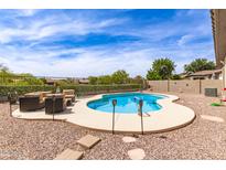 Refreshing backyard pool with ample seating, perfect for outdoor entertaining at 3810 S Star Canyon Dr, Gilbert, AZ 85297