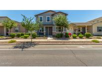 Charming two-story home with a well-manicured front yard and inviting entrance at 3850 E Robert St, Gilbert, AZ 85295