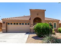 Charming single-story home with tile roof, arched entryway, desert landscaping, and a spacious two-car garage at 3935 E Graphite Rd, San Tan Valley, AZ 85143