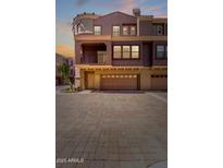 Charming townhome featuring a private balcony and a spacious two-car garage at 3935 E Rough Rider Rd # 1183, Phoenix, AZ 85050