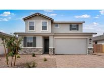 Charming two-story home featuring a neutral color palette, stone accents, and an attached two-car garage at 4064 E Ghost Flower Ln, San Tan Valley, AZ 85140