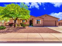 Charming single-story home with well-manicured landscaping and a welcoming entrance at 5635 W Pecan Rd, Laveen, AZ 85339