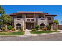 Inviting condo complex with well-maintained landscaping and classic architectural design at 5757 W Eugie Ave # 2084, Glendale, AZ 85304