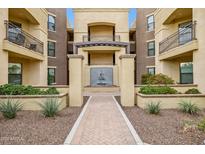 Beautiful building exterior featuring a water fountain and well manicured landscaping at 7601 E Indian Bend Rd # 3002, Scottsdale, AZ 85250