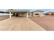 Charming single-story home with a covered carport and well-maintained landscaping at 8337 E Desert Trl, Mesa, AZ 85208