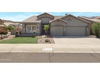 Charming single-Gathering home with a well-manicured lawn, desert landscaping, and a two-car garage at 14801 S 8Th St, Phoenix, AZ 85048