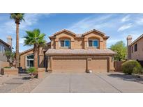 Inviting two-story home with a three-car garage, neutral palette, and manicured landscaping at 15020 S 25Th St, Phoenix, AZ 85048