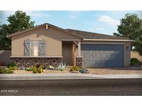 Charming single-story home featuring a stone accent wall and a two-car garage at 162 N 175Th Ave, Goodyear, AZ 85338