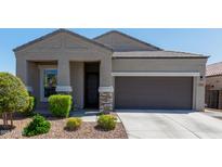 Charming single-story home with a well-manicured front yard and covered entrance at 1919 W Plum Rd, Phoenix, AZ 85085