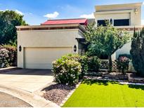 Charming home with manicured landscaping, artificial lawn, and a private two-car garage at 9241 S 50Th St, Phoenix, AZ 85044
