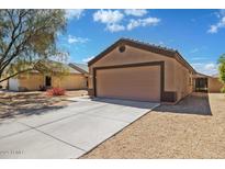 Charming single-story home with a two-car garage and low-maintenance desert landscaping at 12621 W Willow Ave, El Mirage, AZ 85335