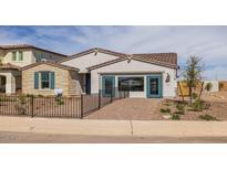 Charming model home with stone accents, a tiled roof, and a welcoming walkway at 12708 W Corona Ave, Avondale, AZ 85323