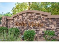 Stone monument sign for Bella Vista is surrounded by foliage at 14000 N 94Th St # 1008, Scottsdale, AZ 85260