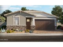 Charming single-story home with stone accents, landscaped yard, and attached two-car garage at 17570 W Adams St, Goodyear, AZ 85338