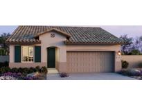 Charming single-story home with a spacious two-car garage, desert landscaping, and a tiled roof at 22360 W Monona Ln, Surprise, AZ 85387