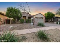 Charming single-Gathering home with stone accents, desert landscaping, and a welcoming facade at 35616 N 34Th Ln, Phoenix, AZ 85086