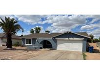Charming single-story home with a well-maintained front yard and a two-car garage at 836 W Laguna Azul Ave, Mesa, AZ 85210