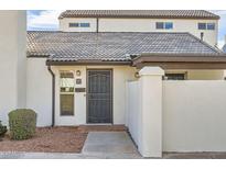 Inviting front entrance showcasing a secure gate, address number, and well-maintained landscaping at 1147 E Belmont Ave, Phoenix, AZ 85020