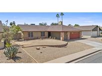 Charming single story home with a two car garage and low maintenance desert landscaping at 2247 W Highland St, Chandler, AZ 85224