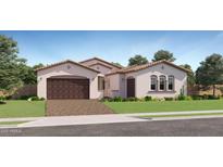 Charming single-story home features a tile roof, stucco exterior, and a spacious two-car garage at 25162 N 177Th Dr, Surprise, AZ 85387
