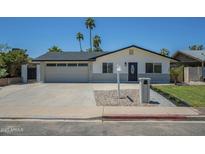 Charming single-story home with desert landscaping, a spacious driveway, and a welcoming entrance at 520 N 23Rd St, Mesa, AZ 85213