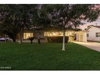 Inviting front exterior featuring well-maintained landscaping, mature trees, and a cozy, suburban aesthetic at 728 E State Ave, Phoenix, AZ 85020