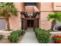 Welcoming entryway with lush landscaping and clearly marked unit numbers enhances curb appeal at 20660 N 40Th St # 1118, Phoenix, AZ 85050