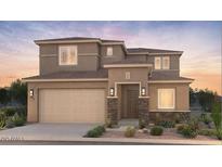 Attractive two-story home featuring a two-car garage and inviting front porch at 21255 E Cattle Dr, Queen Creek, AZ 85142