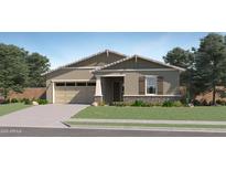 Charming single-story home with a two-car garage, well-maintained lawn, and beautiful desert landscaping at 25338 N 150Th Ln, Surprise, AZ 85387