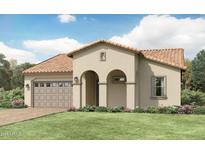 Charming stucco home boasts a well-manicured lawn, arched entryway and a convenient attached garage at 25453 N 176Th Ave, Surprise, AZ 85387