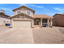 Charming two-story home featuring a well-manicured front yard and a two-car garage at 4118 W Fallen Leaf Ln, Glendale, AZ 85310