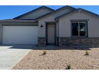 Charming single-story home features desert landscaping, stone accents, and a two-car garage at 7243 E Blissful Breeze Ln, San Tan Valley, AZ 85143