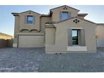 Charming two-story home featuring a large driveway, two-car garage, and neutral color palette at 10984 N 164Th Dr, Surprise, AZ 85388