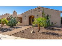 Inviting home with desert landscaping featuring a variety of cactus and stone walkway at 20139 E Via Del Oro --, Queen Creek, AZ 85142