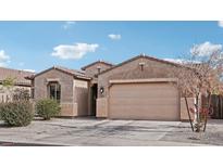 Inviting single-story home featuring a two-car garage and desert landscaping for low maintenance appeal at 23637 W Hopi St, Buckeye, AZ 85326