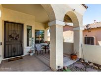 Inviting covered patio with a seating area, perfect for relaxing outdoors at 2489 E Sequoia Dr, Chandler, AZ 85286