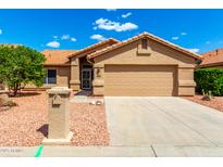 Charming single-story home with a well-maintained lawn and a two-car garage at 3971 N 151St Ln, Goodyear, AZ 85395
