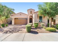 Charming single-story home with a well-manicured front yard and a two-car garage at 4535 E Navigator Ln, Phoenix, AZ 85050