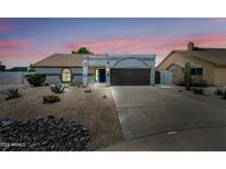 Charming single-story home boasting desert landscaping and a two car garage at 4902 E Golden St, Mesa, AZ 85205